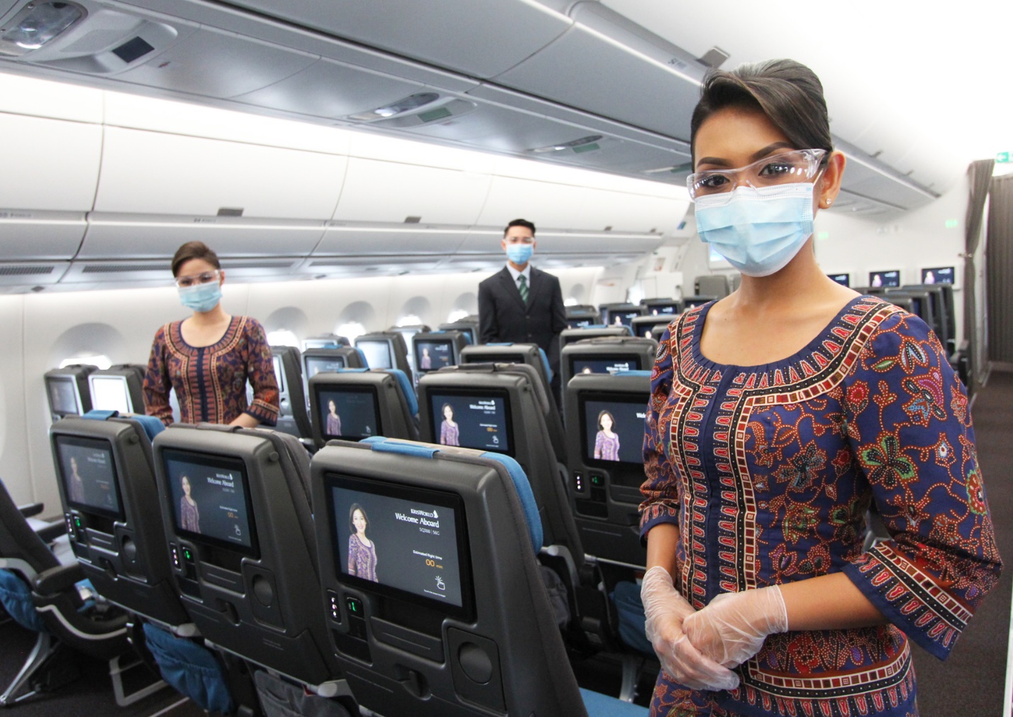 C:\Users\cwah\AppData\Local\Temp\Rar$DRa11572.32372\HKGSQ x HKIA Fly-via-HKG campaign\Cabin crew wear masks and goggles when interacting with customers in the cabin.jpg