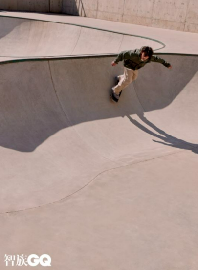 A person riding a skateboard at a skatepark

Description automatically generated